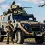 Німецькі військові з бронетранспортером та винищувачем на тлі агресії РФ